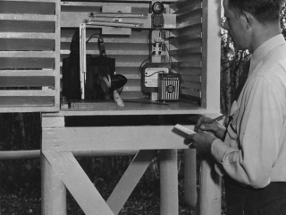 District Ranger Tausch taking readings at a fire danger station.