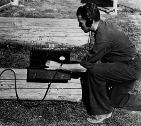 Chuck Wellner measures charges with the Blinkometer to determine log moisture content (U.S. Forest Service, Gisborne Collection).