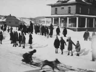 Dog sled race during winter carnival, Munising, Michigan.