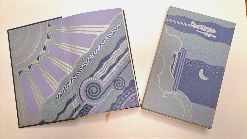 The slipcase and end papers of "Listen! The Wind". 