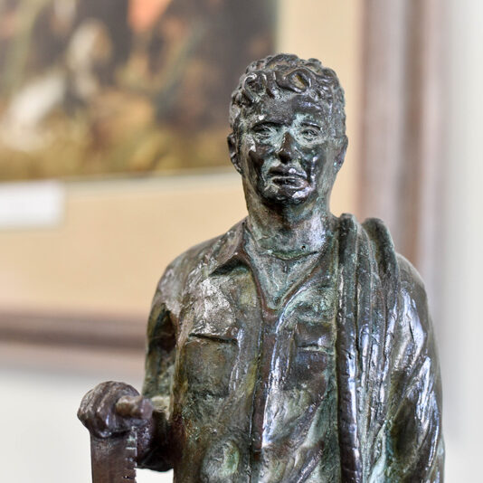 bronze statue of a young man